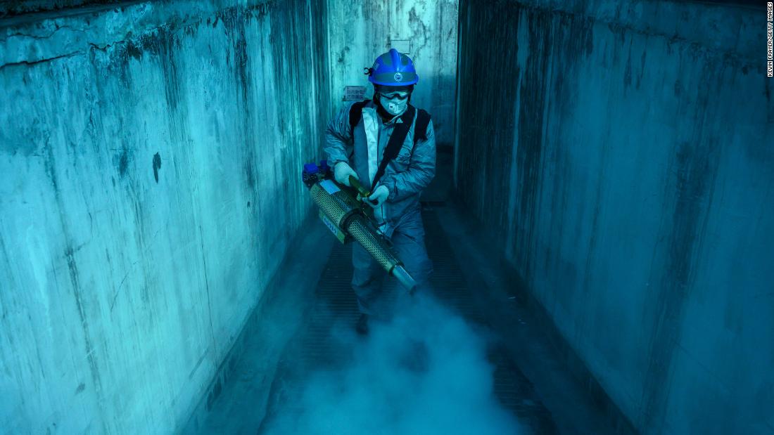 A volunteer from Blue Sky Rescue uses fumigation equipment to disinfect a residential compound in Beijing on March 5.